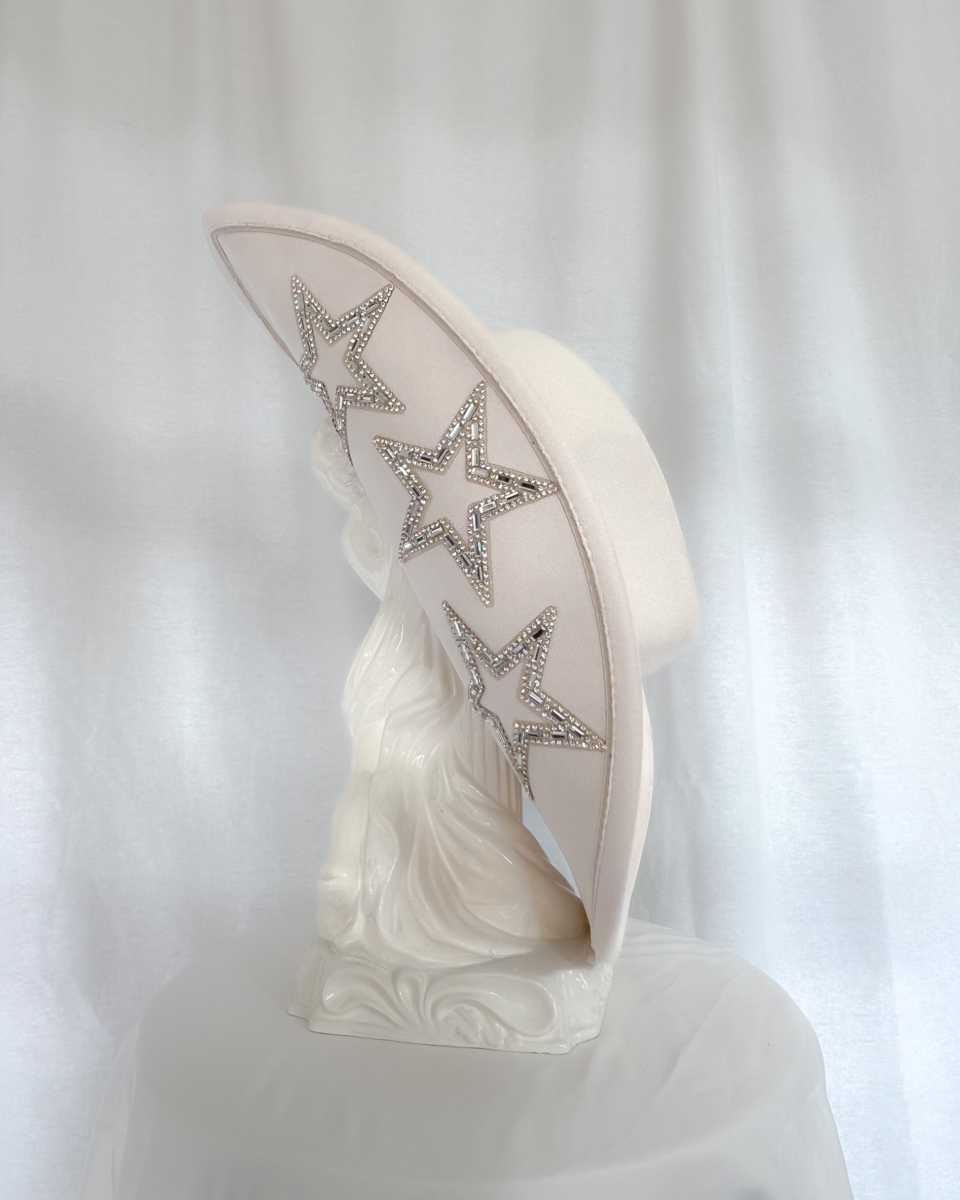 Sparkly cowgirl hat with star detailing and wide brim